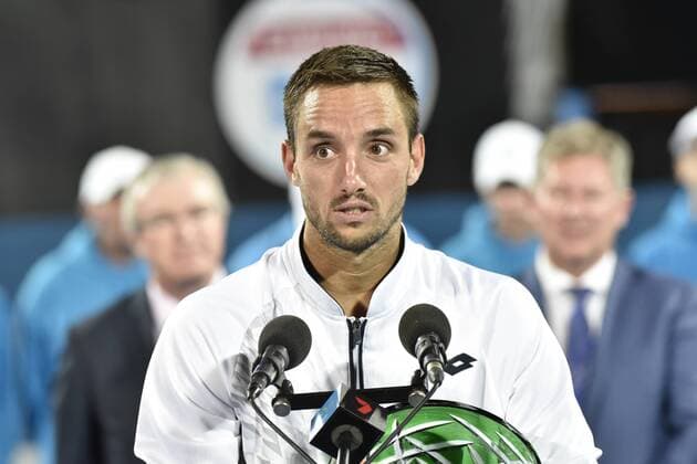 16.01.16 Sydney, Australia. Viktor Troicki (SRB) with trophy as he wins the mens singles title defeating Grigor Dimitrov (BUL) in the mens singles final match at the Apia International Sydney. He receives the trophy from Ken Roewall. Troicki won the final 2-6,6-1,7-6. xNigelxOwenx  ActionPlus11697428