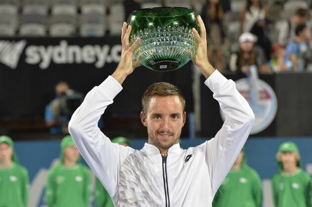 16.01.16 Sydney, Australia. Viktor Troicki (SRB) with trophy as he wins the mens singles title defeating Grigor Dimitrov (BUL) in the mens singles final match at the Apia International Sydney. He receives the trophy from Ken Roewall. Troicki won the final 2-6,6-1,7-6. xNigelxOwenx  ActionPlus11697417