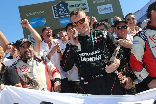 - ROSARIO, ARGENTINA: Dutch driver Gerard De Rooy (C) celebrates after winning with his Iveco Tracker after during the final stage of the 2016 Dakar Rally Race from Villa Carlos Paz to Rosario, Argentina, on Saturday 16 January 2016. The 2016 Dakar Rally takes place from 03 till 16 January 2014 in Argentina and Bolivia. WILLYxWEYENS  x04775560x