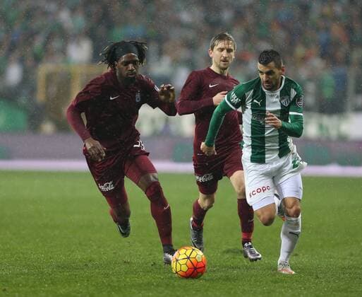 Turkey superlig soccer match between Bursaspor and Trabzonspor at Timsah Arena in Bursa on January 17, 2016. Final Score : Bursaspor 4 - Trabzonspor 2 Pictured : Aziz Behich (R) of Bursaspor and Luis Cavanda , Marko Marin of Trabzonspor. 