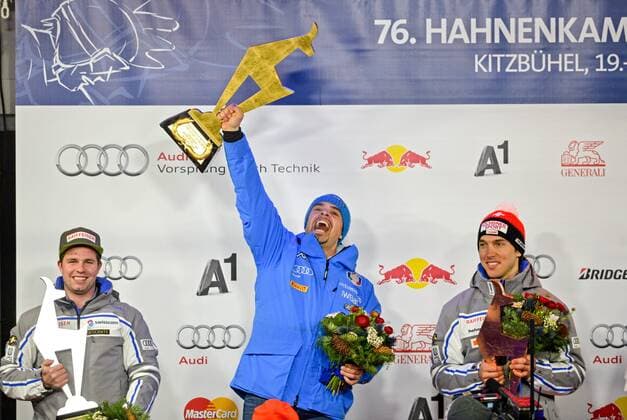 ALPINE SKIING - FIS WC Kitzbuehel KITZBUEHEL,AUSTRIA,23.JAN.16 - ALPINE SKIING - FIS World Cup, Hahnenkamm-race, downhill, men, award ceremony. Image shows Beat Feuz (SUI), Peter Fill (ITA) and Carlo Janka (SUI). Keywords: trophy. GEPAxpictures xHansxOsterauer