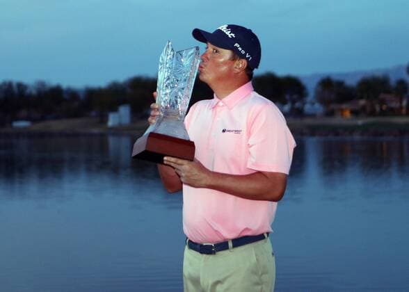 January 24, 2016 Jason Dufner poses with the trophy after winning the CareerBuilder Challenge In Partnership With The Clinton Foundation on the second playoff hole on the 18th green at the TPC Stadium course at PGA Golf Herren West in La Quinta, California.. PGA 2016: CareerBuilder Challenge JAN 24 - ZUMAcb8_