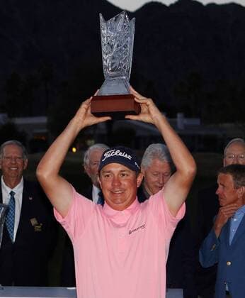 January 24, 2016 Jason Dufner poses with the trophy after winning the CareerBuilder Challenge In Partnership With The Clinton Foundation at the TPC Stadium course at PGA Golf Herren West in La Quinta, California.. PGA 2016: CareerBuilder Challenge JAN 24 - ZUMAcb8_