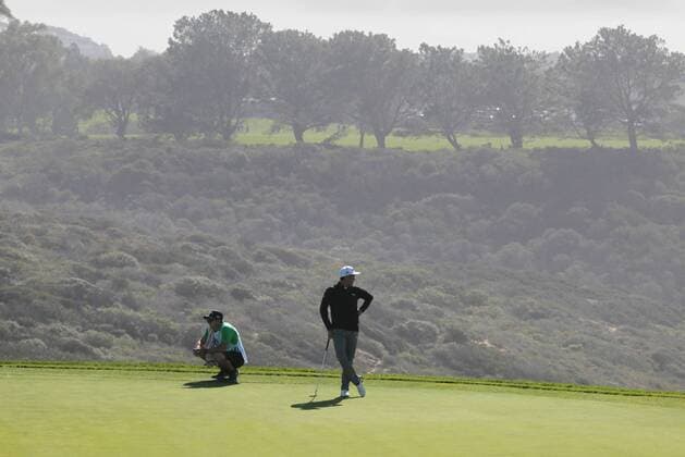 Jan. 29, 2016 - San Diego, CA, USA - Rickie Fowler waits to putt on the 3rd hole during the second round of the Farmers Insurance Open on Torrey Pines south course on Friday, Jan. 29, 2016. Rickie Fowler looks to the ocean as he waits to putt on scenic hole 3 of the South Course. - ZUMAm67_