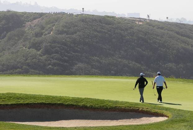 Jan. 29, 2016 - San Diego, CA, USA - Rickie Fowler, left, and Patrick Reed walk on to the 3rd green during the second round of the Farmers Insurance Open on Torrey Pines south course on Friday, Jan. 29, 2016. Rickie Fowler looks to the ocean as he waits to putt on scenic hole 3 of the South Course. - ZUMAm67_