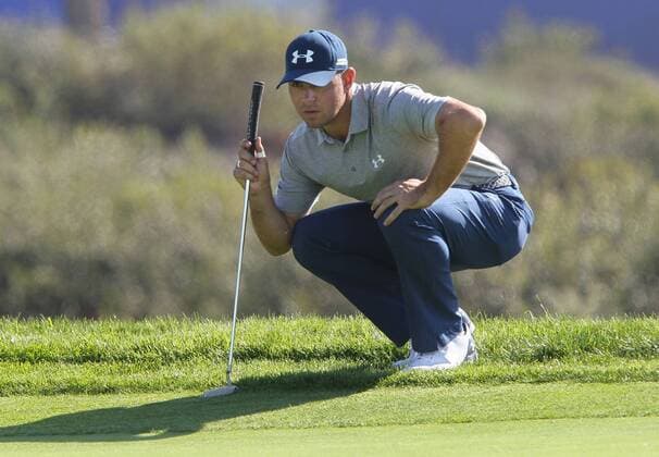 Jan. 29, 2016 - San Diego, CA, USA - Gary Woodland sizes up a putt on the 14th hole during the second round of the Farmers Insurance Open on Torrey Pines south course on Friday, Jan. 29, 2016. Rickie Fowler looks to the ocean as he waits to putt on scenic hole 3 of the South Course. - ZUMAm67_