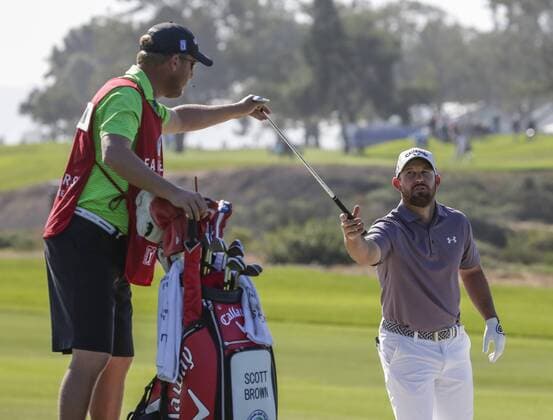 January 29, 2016: Scott Brown is handed a wedge along the 4th fairway of the North Course during the second round of the Farmers Insurance Open at Torrey Pines Golf Course in San Diego, California. PGA Golf Herren 2016: Farmers Insurance Open JAN 29 - ZUMAc04_