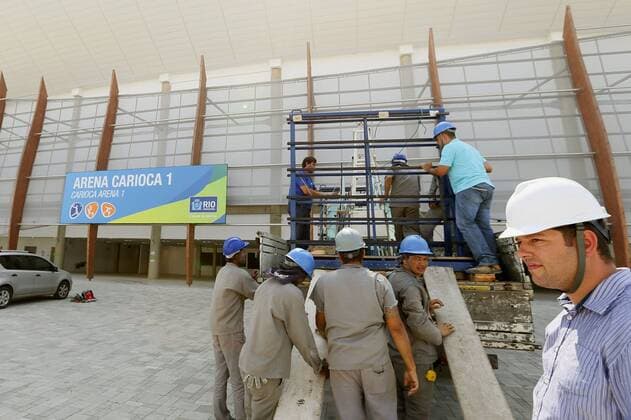 Construction under way with clock ticking until Rio Olympics Construction work is under way near the Carioca Arena (background), the venue of Rio de Janeiro Olympics basketball events, at the Barra Olympic Park in the Brazilian city on Feb. 3, 2016. Although 97 percent of the venues at the Olympic park are ready, work is still ongoing in the summer heat with just over a half a year to go to the start of the Games. 