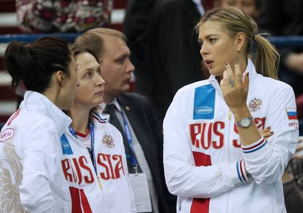 MOSCOW, RUSSIA. FEBRUARY 6, 2016. Maria Sharapova (R), Anastasia Myskina (L) of Russia and Russian women s national tennis team head coach Elena Likhovtseva (2nd L) seen during the 2016 Fed Cup World Group 1st Round Russia vs the Netherlands tennis event at Olympic Stadium. Sergei Bobylev TASS  TS016AED