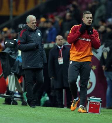 Turkey superlig soccer match between Galatasaray and Torku Konyaspor at Turk Telekom Arena in Istanbul on February 06, 2016. Pictured: Coach Mustafa Denizli and Lukas Podolski of Galatasaray . 