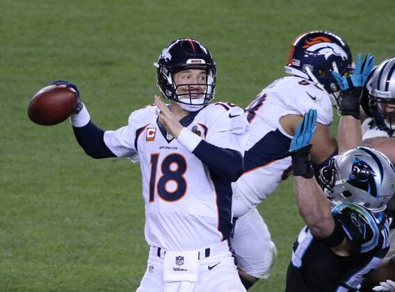 Denver Broncos QB Peyton Manning throws over a Carolina Panthers rush in the third quarter of Super Bowl 50 at Levi s Stadium in Santa Clara, California, February 7, 2015. The Denver Broncos defeated the Carolina Panthers 24-10.  SBP20160207077 KHALEDxSAYED