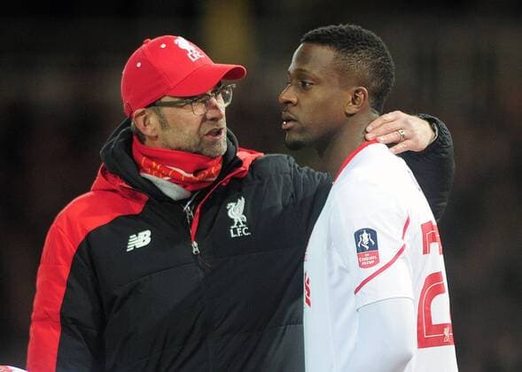 Football - 2015 2016 FA Cup - Fourth Round Replay: West Ham United vs. Liverpool Liverpool manager Jurgen Klopp talks to Divock Origi at Upton Park. COLORSPORT ANDREW COWIE It was Klopp s first match back after having emergency surgery to remove his appendix. 