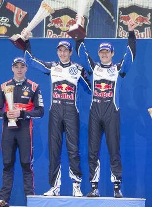 Motorsport, WRC, Rallye Schweden, Siegerehrung 160214 Sebastien Ogier med kartläsare Julien Ingrassia, Volkswagen Motorsport, Volkswagen Polo WRC Motorsport Rallye WM jublar efter segern till vänster skymtar Hayden Paddon vid prisutdelningen under Rally Sweden den 14 februari 2016 i Karlstad.  Copyright: ANNA-LENAxBERGQVIST BB160214BB839