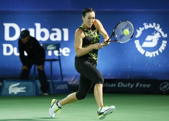 Jelena Jankovic of Serbia hits a return during the women s singles first round match against Belinda Bencic of Switzerland at the 2016 WTA Tennis Damen Dubai Open in Dubai, the United Arab Emirates, on Feb. 16, 2016. Jelena Jankovic won 2-1. ) (lm) (SP)UAE-DUBAI-TENNIS-DUBAI OPEN LixZhen 