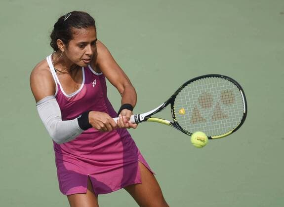 NEW DELHI, INDIA - FEBRUARY 17: Indian tennis player Ankita Raina in action against Russian tennis player Marina Melnikova during Delhi Open 2016 tournament at DLTA Complex (Delhi Lawn Tennis Association) on February 17, 2016 in New Delhi, India. (Photo by Vipin Kumar Hindustan Times ) Delhi Open 2016 Tournament