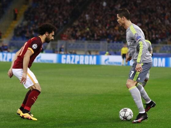 Feb. 17, 2016 - Rome, Italy - Real Madrid s Portuguese forward Cristiano Ronaldo (R) fights for the ball with Roma s forward from Egypt Mohamed Salah during the UEFA Champions League roud of 16 fIrst leg football match AS Roma vs Real Madrid CF on February 17, 2016 at the Olimpico Stadium. Italy: UEFA Champions League football match Roma vs Real Madrid in Rome - ZUMAp133
