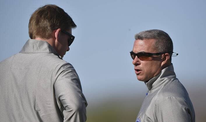 Feb. 20, 2016 - Surprise, AZ, USA - Kansas City Royals general manager Dayton Moore, right, visits with Baseball Operations Assistant Player Development Chris Getz during a spring training workout on Saturday, Feb. 20, 2016, in Surprise, Ariz. Kansas City Royals spring training - ZUMAm67_
