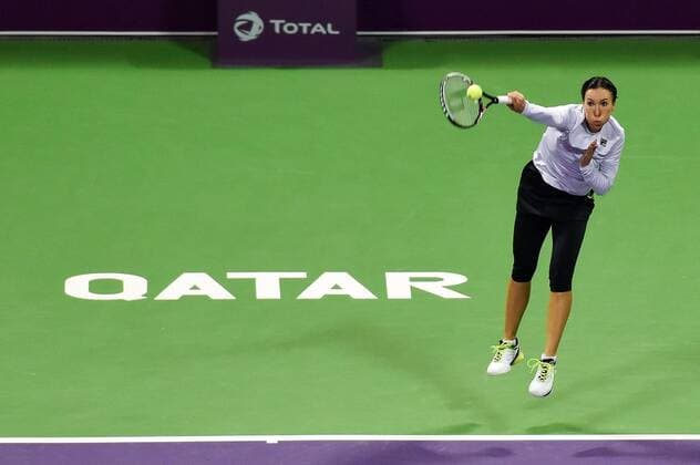 Jelena Jankovic of Serbia serves the ball during the women s singles match against Jana Cepelova of Slovakia at WTA Tennis Damen Qatar Open 2016 at the International Khalifa Tennis Complex of Doha, Qatar, Feb. 22, 2016. Jelena Jankovic won 2-1. ) (SP)QATAR-DOHA-TENNIS-QATAR OPEN 2016-WOMEN S SINGLES Nikku 
