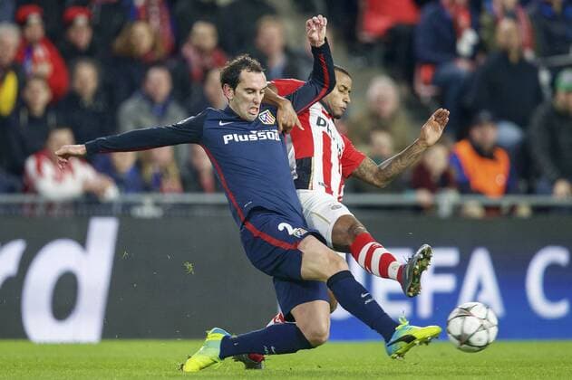 (L-R) Diego Godin of Club Atletico de Madrid, Luciano Narsingh of PSV during the UEFA Champions League Round of 16, First leg match between PSV Eindhoven and Atletico Madrid on February 24, 2016 at the Philips stadium in Eindhoven, The Netherlands. PSV v Atletico Madrid UEFA Champions League 2015 2016 xVIxxIVx 5037392
