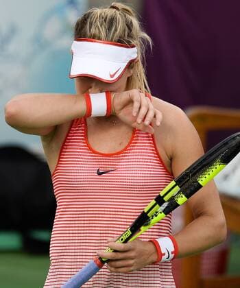 (160225) -- DOHA, Feb. 25, 2016 -- Eugenie Bouchard of Canada reacts during the singles third round match against Zheng Saisai of China at the WTA Tennis Damen Qatar Open 2016 in Doha, Qatar, Feb. 24, 2016. Zheng Saisai won 2-0. ) (SP)QATAR-DOHA-TENNIS-WTA QATAR OPEN 2016 Nikku 