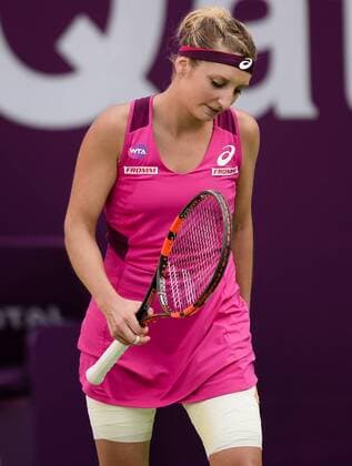 (160225) -- DOHA, Feb. 25, 2016 -- Timea Bacsinszky of Switzerland reacts during the singles third round match against Carla Suarez Navarro of Spain at the WTA Tennis Damen Qatar Open 2016 in Doha, Qatar, Feb. 24, 2016. Carla Suarez Navarro won 2-0. ) (SP)QATAR-DOHA-TENNIS-WTA QATAR OPEN 2016 Nikku 