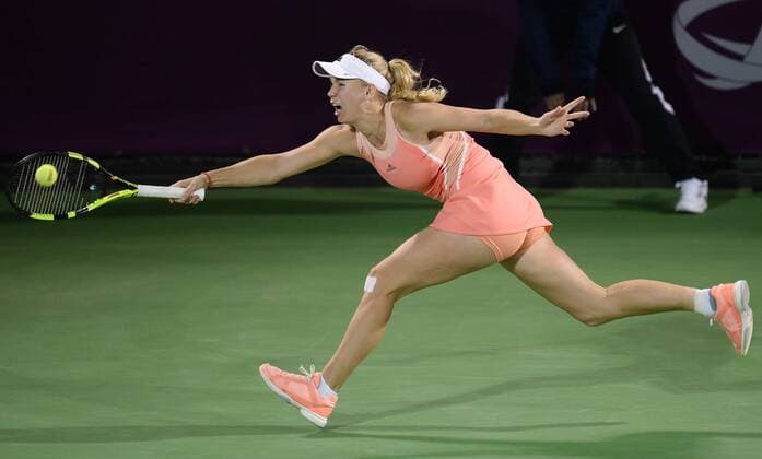 (160225) -- DOHA, Feb. 25, 2016 -- Caroline Wozniacki of Denmark competes during the singles third round match against Elena Vesnina of Russia at the WTA Tennis Damen Qatar Open 2016 in Doha, Qatar, Feb. 24, 2016. Elena Vesnina won 2-1. ) (SP)QATAR-DOHA-TENNIS-WTA QATAR OPEN 2016 Nikku 