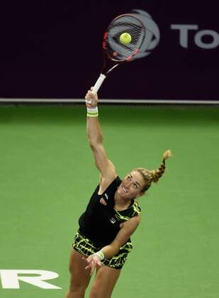 (160225) -- DOHA, Feb. 25, 2016 -- Timea Babos of Hungary competes during the singles third round match against Garbine Muguruza of Spain at the WTA Tennis Damen Qatar Open 2016 in Doha, Qatar, Feb. 24, 2016. Garbine Muguruza won 2-0. ) (SP)QATAR-DOHA-TENNIS-WTA QATAR OPEN 2016 Nikku 
