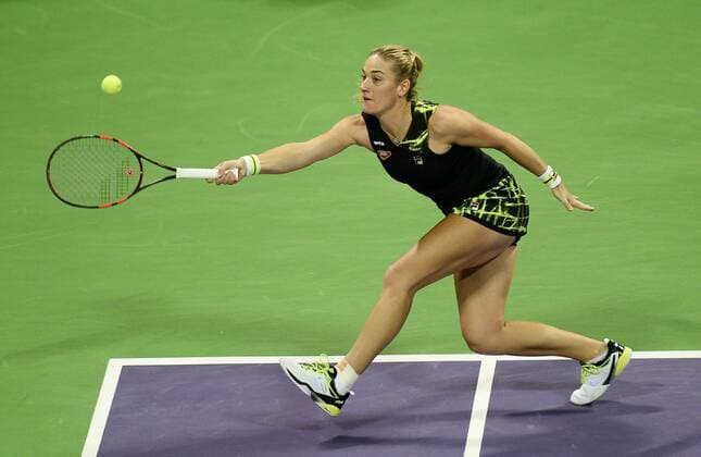 (160225) -- DOHA, Feb. 25, 2016 -- Timea Babos of Hungary competes during the singles third round match against Garbine Muguruza of Spain at the WTA Tennis Damen Qatar Open 2016 in Doha, Qatar, Feb. 24, 2016. Garbine Muguruza won 2-0. ) (SP)QATAR-DOHA-TENNIS-WTA QATAR OPEN 2016 Nikku 