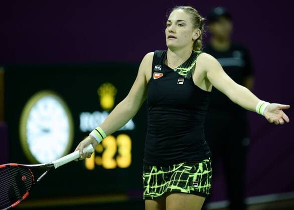 (160225) -- DOHA, Feb. 25, 2016 -- Timea Babos of Hungary reacts during the singles third round match against Garbine Muguruza of Spain at the WTA Tennis Damen Qatar Open 2016 in Doha, Qatar, Feb. 24, 2016. Garbine Muguruza won 2-0. ) (SP)QATAR-DOHA-TENNIS-WTA QATAR OPEN 2016 Nikku 