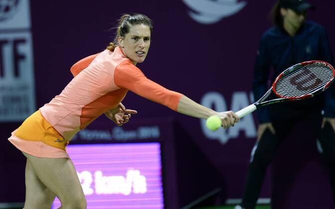 DOHA, Feb. 25, 2016 -- Andrea Petkovic of Germany competes during the women s singles quarterfinal match against Garbine Muguruza of Spain at the WTA Tennis Damen Qatar Open 2016 in Doha, Qatar, Feb. 25, 2016. Andrea Petkovic won 2-1. ) (SP)QATAR-DOHA-TENNIS-WTA QATAR OPEN 2016 Nikku 