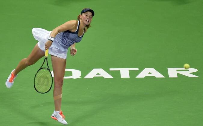 (160227) -- DOHA, Feb. 26, 2016 -- Jelena Ostapenko of Latvia rserves the ball during the women s singles semi-final match against Andrea Petkovic of Germany at the WTA Tennis Damen Qatar Total Open 2016 in Doha, Qatar Feb. 26, 2016. Jelena Ostapenko won 7-5, 1-0 after Andrea Petkovic abandoned due to an injury. ) (SP)QATAR-DOHA-TENNIS-WTA QATAR OPEN 2016 Nikku 
