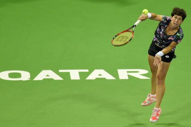 Carla Suarez Navarro of Spain serves the ball during women s singles final against Jelena Ostapenko of Latvia in the at the WTA Tennis Damen Qatar Total Open 2016 at the International Khalifa Tennis Complex Doha, Qatar February 27, 2016. Carla Suarez Navarro won 2-1 and claimed the title. ) (SP)QATAR-DOHA-TENNIS-WTA QATAR OPEN 2016 Nikku 