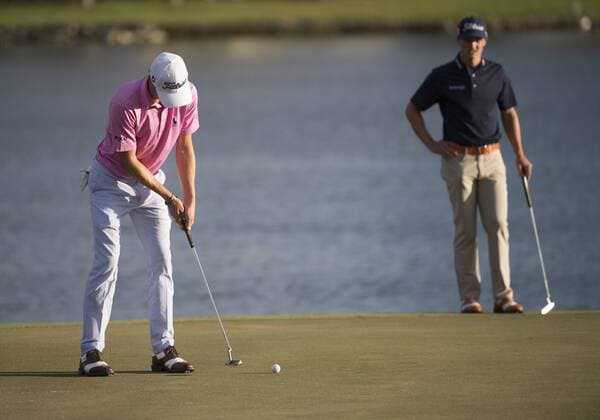 28 February 2016: Justin Thomas putts at the 18th hole as Blayne Barber watches during the final round of the Honda Classic at the PGA Golf Herren National Resort & Spa in Palm Beach Gardens, FL. (Photo by Doug Murray Icon Sportswire) GOLF: FEB 28 PGA - The Honda Classic - Final Round Icon796160228037 EDITORIAL USE ONLY