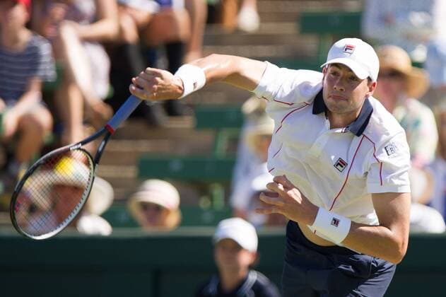 (160304) -- MELBOURNE, March 4, 2016 -- John Isner of USA returns the ball during his men s single match against Sam Groth of Australia during Davis Cup by BNP Paribas World Group first round tie between Australia and USA at Kooyong Lawn Tennis Club in Melbourne, Australia, March 4, 2016. John Isner won 3-0. ) (SP)AUSTRALIA-MELBOURNE-TENNIS-DAVIS CUP BaixXue 