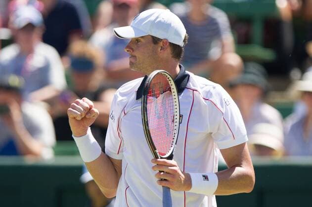 (160304) -- MELBOURNE, March 4, 2016 -- John Isner of USA celebrates after winning his men s single match against Sam Groth of Australia during Davis Cup by BNP Paribas World Group first round tie between Australia and USA at Kooyong Lawn Tennis Club in Melbourne, Australia, March 4, 2016. John Isner won 3-0. ) (SP)AUSTRALIA-MELBOURNE-TENNIS-DAVIS CUP BaixXue 