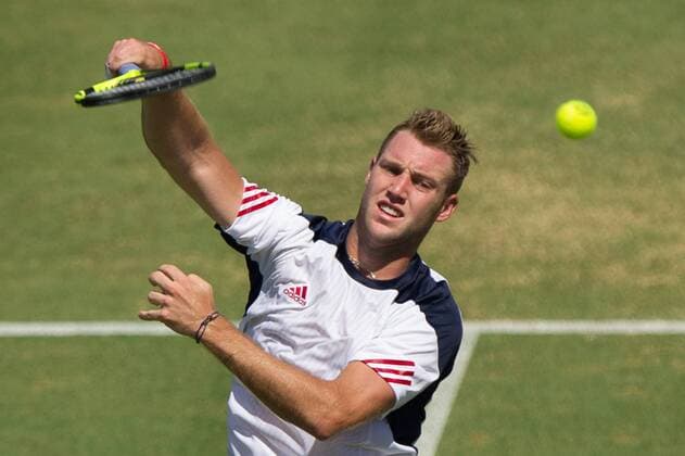 (160304) -- MELBOURNE, March 4, 2016 -- Jack Sock of the United States returns the ball during his men s single match against Bernard Tomic of Australia during Davis Cup by BNP Paribas World Group first round tie between Australia and USA at Kooyong Lawn Tennis Club in Melbourne, Australia, March 4, 2016. Jack Sock lost the match 1-3. ) (SP)AUSTRALIA-MELBOURNE-TENNIS-DAVIS CUP BaixXue 