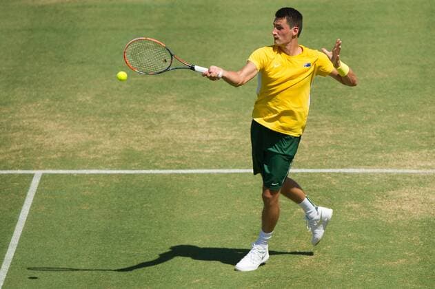 (160304) -- MELBOURNE, March 4, 2016 -- Bernard Tomic of Australia returns the ball during his men s single match against Jack Sock of the United States during Davis Cup by BNP Paribas World Group first round tie between Australia and USA at Kooyong Lawn Tennis Club in Melbourne, Australia, March 4, 2016. Bernard Tomic won 3-1. ) (SP)AUSTRALIA-MELBOURNE-TENNIS-DAVIS CUP BaixXue 