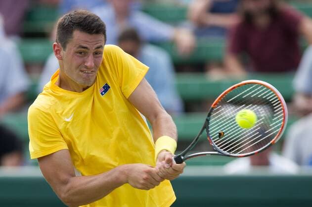 (160304) -- MELBOURNE, March 4, 2016 -- Bernard Tomic of Australia returns the ball during his men s single match against Jack Sock of the United States during Davis Cup by BNP Paribas World Group first round tie between Australia and USA at Kooyong Lawn Tennis Club in Melbourne, Australia, March 4, 2016. Bernard Tomic won 3-1. ) (SP)AUSTRALIA-MELBOURNE-TENNIS-DAVIS CUP BaixXue 