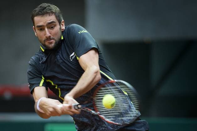 Croatian Marin Cilic performs during the first game, a single game between Belgian Kimmer Coppejans ATP Tennis Herren 122) and Croatian Marin Cilic (ATP 12) on the first day of the Davis Cup first round World Group meeting between Belgium and Croatia, Friday 04 March 2016, in Angleur, Liege. The first round will be played from 04 to 06 March 2016, Liege. BENOITxDOPPAGNE  x04804469x