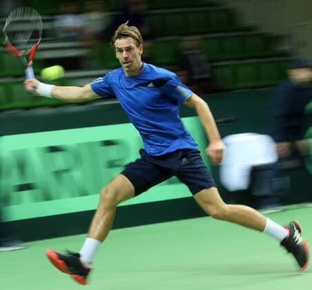 KAZAN, RUSSIA. MARCH 4, 2016. Sweden s Isak Arvidsson returns a ball in a Davis Cup Group I Europe Africa Zone 1st Round tennis match against Russia at Kazan Tennis Academy. Russia won 4-6, 6-1, 6-1, 6-4. Yegor Aleyev TASS  TS018931