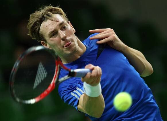 KAZAN, RUSSIA. MARCH 4, 2016. Sweden s Isak Arvidsson returns a ball in a Davis Cup Group I Europe Africa Zone 1st Round tennis match against Russia at Kazan Tennis Academy. Russia won 4-6, 6-1, 6-1, 6-4. Yegor Aleyev TASS  TS01892D