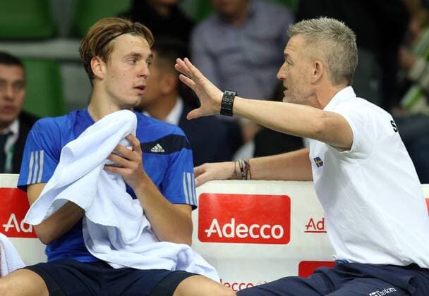 KAZAN, RUSSIA. MARCH 4, 2016. Sweden s Isak Arvidsson (L) listens to coach Fredrik Rosengren in their Davis Cup Group I Europe Africa Zone 1st Round tennis match against Russia at Kazan Tennis Academy. Russia won 4-6, 6-1, 6-1, 6-4. Yegor Aleyev TASS  TS01891A