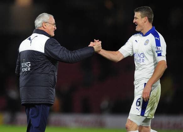 Football - 2015 2016 Premier League - Watford vs Leicester City. Leicester City manager Claudio Ranieri celebrates with Robert Huth at the final whistle at Vicarage Road. COLORSPORT ANDREW COWIE 