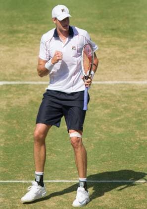 (160306) -- MELBOURNE, Mar. 6, 2016 -- John Isner of USA reacts during his men s singles match against Bernard Tomic of Australia during Davis Cup by BNP Paribas World Group first round tie between Australia and USA at Kooyong Lawn Tennis Club in Melbourne, Australia, Mar. 6, 2016. John Isner won 3-1, making USA won Australia with 3-1. ) (SP)AUSTRALIA-MELBOURNE-TENNIS-DAVIS CUP BaixXue 