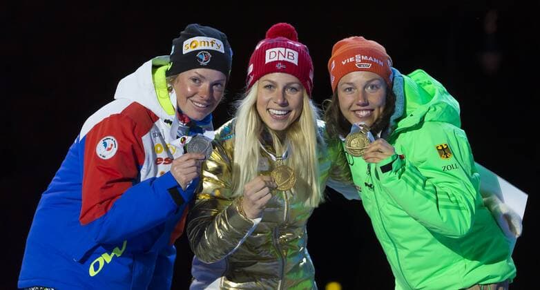 05.03.2016. Oslo Holmenkollen, Oslo, Norway. IBU Biathlon World Cup. Day One. Marie Dorin Habert of France second place, Tiril Eckhoff of Norway first place and Laura Dahlmeier of Germany third place winner of ladies 7.5km at the medal ceremony during the IBU World Championships Biathlon in Holmenkollen Oslo, Norway. xNigelxWaldronx  ActionPlus11715024