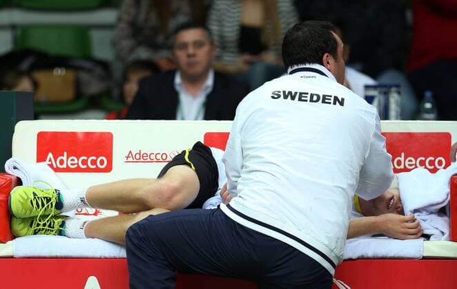 Tennis, Davis Cup, Russland - Schweden KAZAN, RUSSIA. MARCH 6, 2016. Sweden s tennis player Daniel Windahl (lying on the bench) receives treatment for his injury in Rubber 5 of the Davis Cup Group I Europe Africa Zone 1st Round tie against Russia at Kazan Tennis Academy. Windahl lost 6-2, 6-2. Sweden lost the tie 5-0. Yegor Aleyev TASS  TS018B47