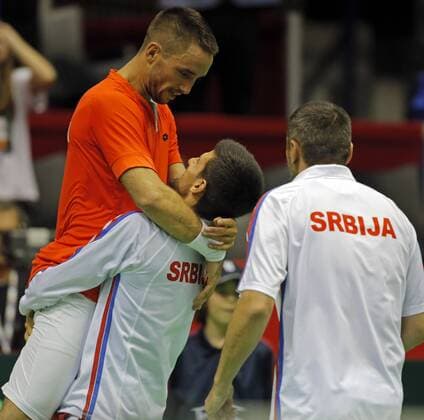 BELGRADE, March 6, 2016 -- Serbia s tennis players Viktor Troicki (L) and Novak Djokovic (C) celebrate victory against Kazakhstan during the Davis Cup World Group first round match between Serbia and Kazakhstan at Aleksandar Nikolic hall in Belgrade, on March 6, 2016. Troicki won 3-0 in the final match and brought overall victory over Kazakhstan. Serbia will compete with Great Britain in quarterfinals scheduled for July 15-17.) (SP)SERBIA-BELGRADE-TENNIS-DAVIS CUP-SERBIA VS KAZAKHSTAN PredragxMilosavljevic 