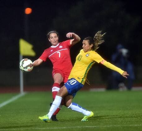 ALBUFEIRA, March 9, 2016 -- Canada s Rhian Wilkinson (L) vies the ball with Brazil s Marta Da Silva during the final match of 2016 Algarve Cup women s soccer tournament between Canada and Brazil at the Bela Vista Municipal Stadium in Parchal, Portugal, on March 9, 2016. Canada won 2-1 and thus claimed the title. ) (SP)PORTUGAL-ALBUFEIRA-ALGARVE CUP-CANADA VS BRAZIL ZhangxLiyun 