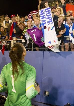 09 March 2016: United States Goalkeeper Hope Solo (1) signs her shoes before giving them to fans in the stands after USA won the SheBelieves Cup soccer match against Germany at the FAU Stadium in Boca Raton, Florida. (Photo by Doug Murray Icon Sportswire) SOCCER: MAR 09 Women s - SheBelieves Cup - USA v Germany Icon796160309016 EDITORIAL USE ONLY
