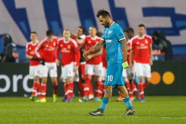 March 9, 2016 - St. Petersburg, STP, Russia - Danny of Zenit (C) reacts as Benfica players celebrate a victory on the background during the UEFA Champions League Round of 16 second leg match between FC Zenit St. Petersburg and SL Benfica at Petrovsky stadium on 9th March 2016. FC Zenit St. Petersburg v SL Benfica - UEFA Champions League  - ZUMAn230
